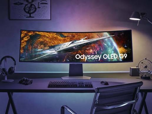Samsung Odyssey OLED G9 curved ultra-wide gaming monitor with AI contrast.