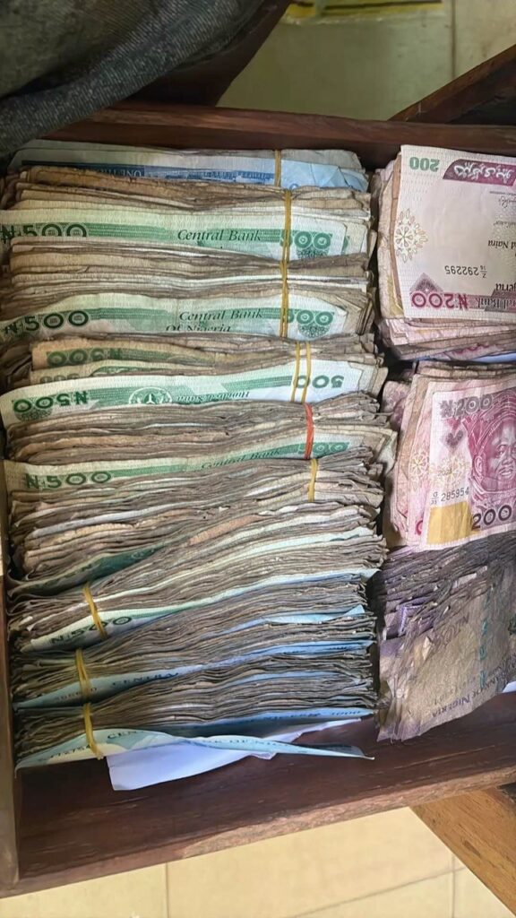 Stacks of Nigerian naira illustrating financial losses linked to digital payment fraud.