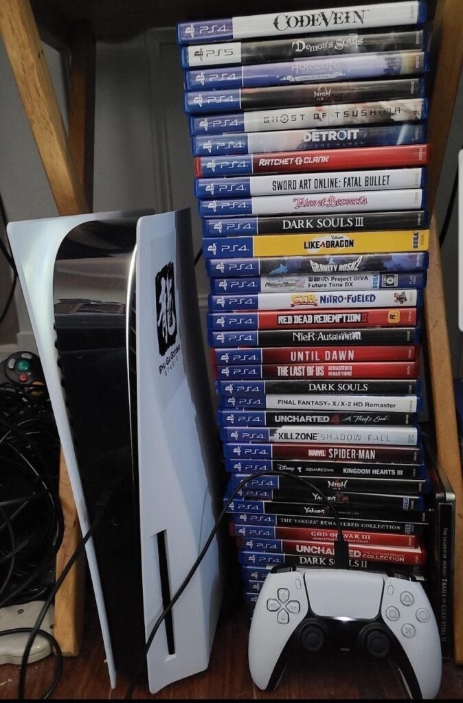 Collection of PlayStation physical game cases on a shelf.