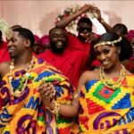 Traditional Ghanaian marriage ceremony with couple exchanging rings