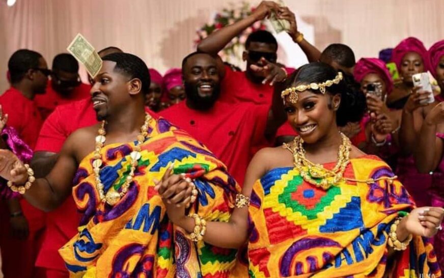 Traditional Ghanaian marriage ceremony with couple exchanging rings
