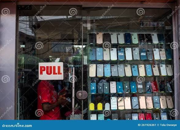 Mobile phone retailer in Nigeria displaying smartphones for sale
